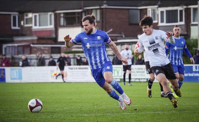Ryan Wilson (left) is hassled by Brig's goalscorer Rob Apter on Saturday (IMAGE: Bamber Bridge Football Club)