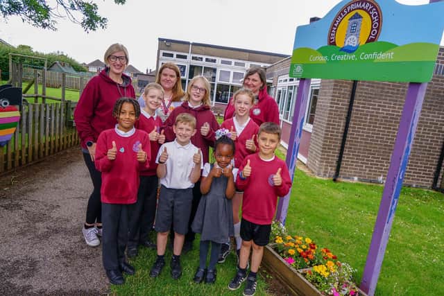 Pupils at Leen Mills Primary School celebrate their good Ofsted with assistant headteacher Hayley Owen, back left, and Nicola Davies, back right, and headteacher Karen Goldson. (Photo by: Brian Eyre/nationalworld.com)