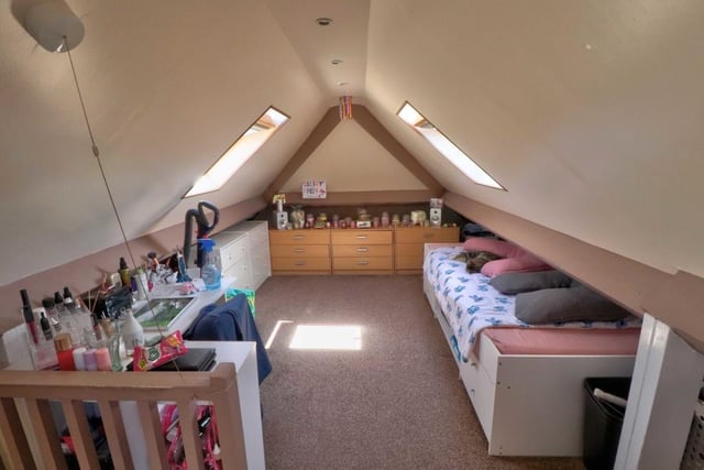 This is the attic room, which has a host of flexible uses. The current owners have installed Velux windows to the front and rear and are and are using it as a fifth bedroom.