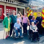 Staff and residents from Hall Park Care Home with the team from Stockhill Fire Station.