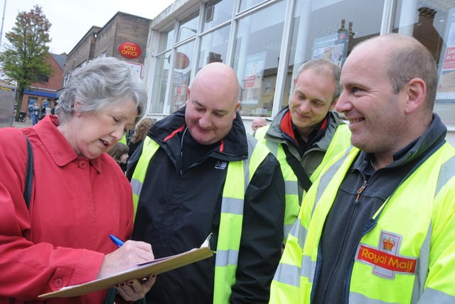 2010: Jacky Watson signs a petition to keep Royal Mail in public ownership outside Hucknall Post Office.
