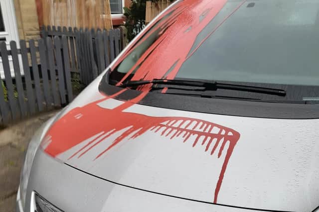 Red paint all over one of the vehicles