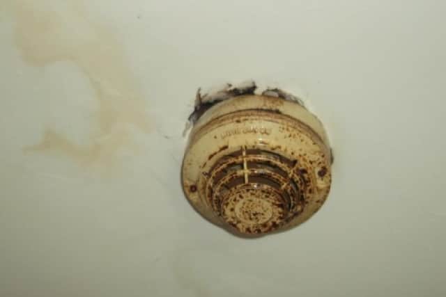 A dirty and broken smoke alarm was one of the issues at the HMO in Hucknall