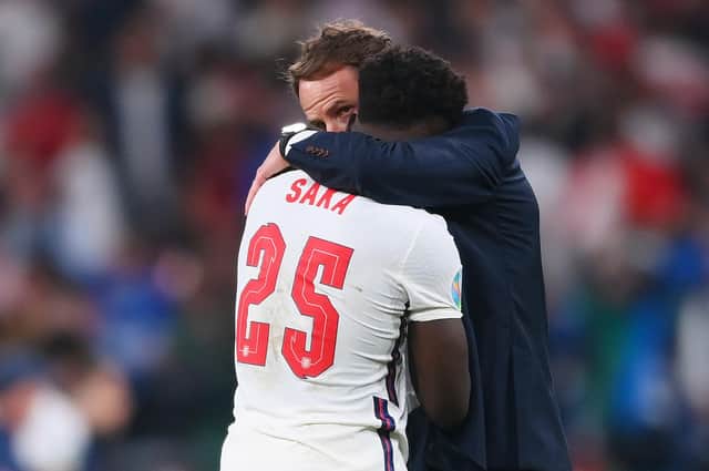 Bukayo Saka is consoled by Gareth Southgate.