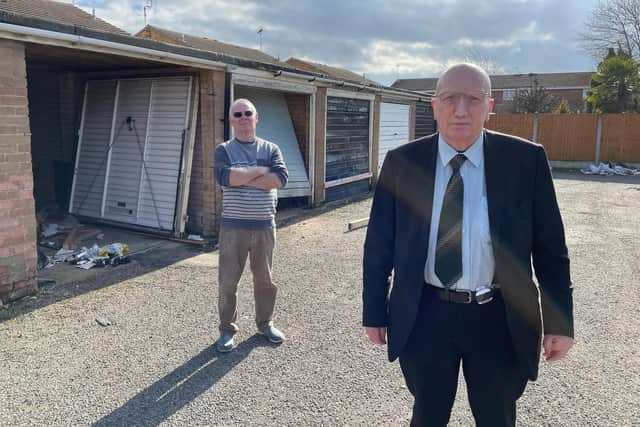 Coun John Wilmott with local resident Frank Wilkinson at the garages on Balmoral Grove