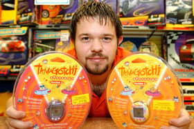 Tom Evans Assistant Manager of Toymaster in Meadowhall, with a Tamagotchi which was predicted  to  be a Christmas best seller