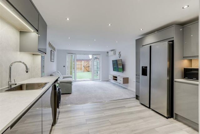 There's only one place to start our tour of the £290,000-plus Linnet Way property -- and that's in the superb open-plan space on the ground floor that seamlessly integrates the kitchen and living room.
