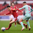 Joe Lolley breaks past Matt Grimes during the 1-0 defeat at home to Swansea City. (Photo by Laurence Griffiths/Getty Images)