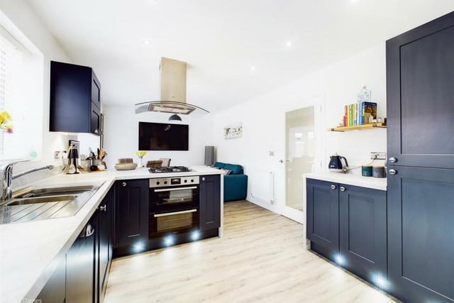The open-plan dining kitchen is a stunning space, complete with an integrated, electric double oven and gas hob with extractor over.