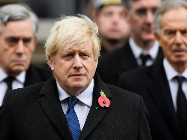 Former prime ministers, Gordon Brown (left) and Tony Blair (right) stand behind Prime Minister Boris Johnson, during the Remembrance Sunday service at the Cenotaph, in Whitehall, London.