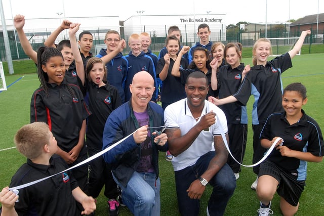 Pro footballers Wes Morgan and Lee Hughes join forces to officially open the sports pitches at Bulwell Academy in 2011.