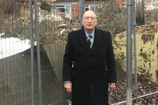 Coun Wilmott outside the 'eyesore' former Romans pub site which the owners now have until Valentine's Day to clean up