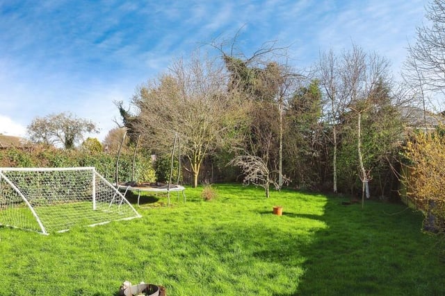The garden at the back of the property has scope to be used for play or for relaxation. It's part of a large and desirable plot of land.