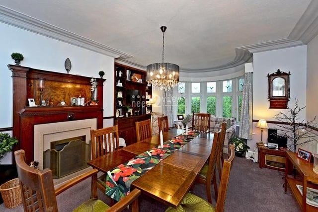 A second shot of the dining room, with its beautiful, big bay window facing the front of the house, its feature fireplace and its stylish ceiling coving.