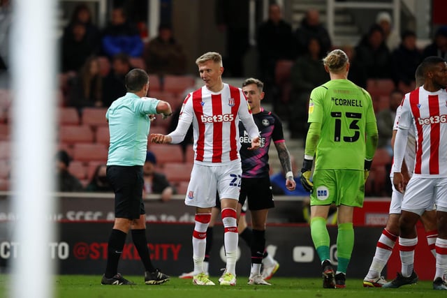 Sam Surridge of Stoke City argues with players from Peterborough United which resulted in a red card. It is one of four reds for Stoke this season.