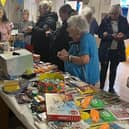 Residents and visitors immersed in cheerful conversation at the Park House summer fair stands. (Photo by: Park House Care Home)