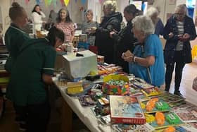 Residents and visitors immersed in cheerful conversation at the Park House summer fair stands. (Photo by: Park House Care Home)