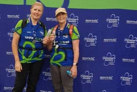 Tracy Elmer (right) celebrates completing the challenge with a fellow walker