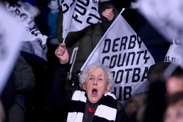 An elderly Derby County fan shows her support for Derby County at Pride Park Stadium on December 17, 2018.