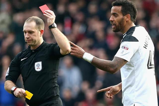Tom Huddleston is shown a red card during the match at the City Ground on March 11, 2018.