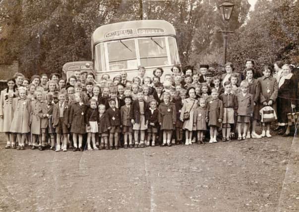1952: Smiles all round... a wonderful snap showing Hucknall Empire Clubs outing to Cleethorpes, organised by Mr Tilley. Picture courtesy of Nottinghamshire Archives.