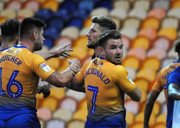 Mansfield Town v Sheffield Wednesday.
Alex McDonald turns peace maker after trouble erupted at the end of the friendly game.