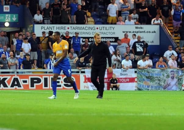 Mansfield Town v Sheffield Wednesday.
Krystian Pearce is lead away from trouble at the end of the game.