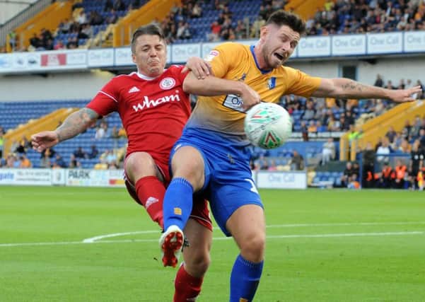 Mansfield Town v Accrington Stanley.
Mansfield's second penalty is awarded after this challenge in the first half.