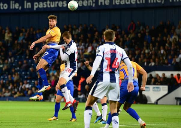 Picture by Howard Roe/AHPIX.com;Football;Skybet;Carabao Cup; Round 2
West Bromwich Albion v Mansfield Town
28/8/2018  KO 8.00 pm; The Hawthorns;
copyright picture;Howard Roe;07973 739229

Stag's Ryan Sweeney heads the ball back into the Baggies box