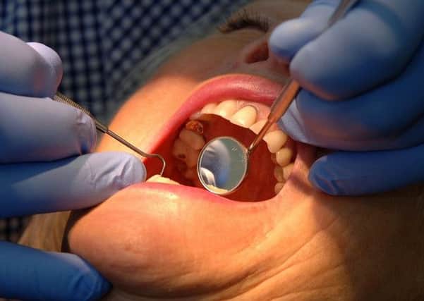 The number of people taking up free NHS dental treatments has dropped