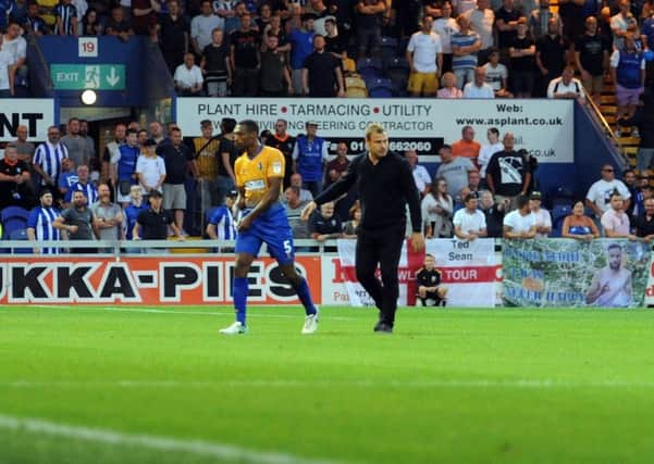 Mansfield Town v Sheffield Wednesday. Krystian Pearce is led away from trouble at the end of the game.
