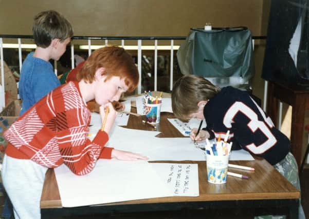 1987: This nostalgic snap features one of the childrens activities held at Hucknall Library. These three boys are creating a story for a tape slide presentation. Picture courtesy of Nottinghamshire Archives.