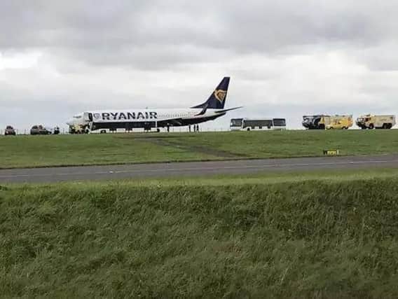 The damaged plane after it had touched down at East Midlands Airport