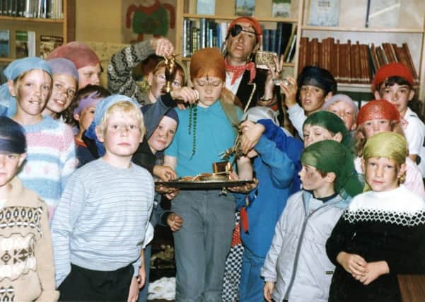 1987: Shiver my timbers...this fabulous nostalgic snap features children playing at being pirates at Hucknall Library. Tina Glover is pictured at the back. Picture courtesy of Nottinghamshire Archives.