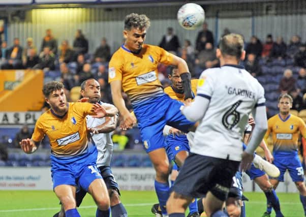 Mansfield Town v Oldham.
Tyler Walker gets in a header in the first half.