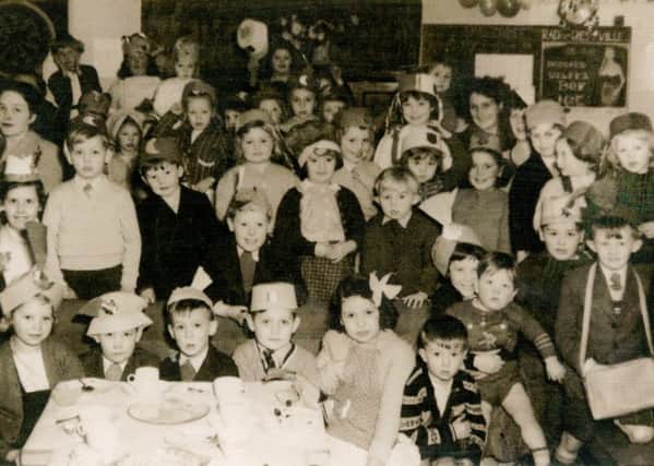 1960: These children are enjoying a party held at West Street Social Club in Hucknall. Picture courtesy of Nottinghamshire Archives.