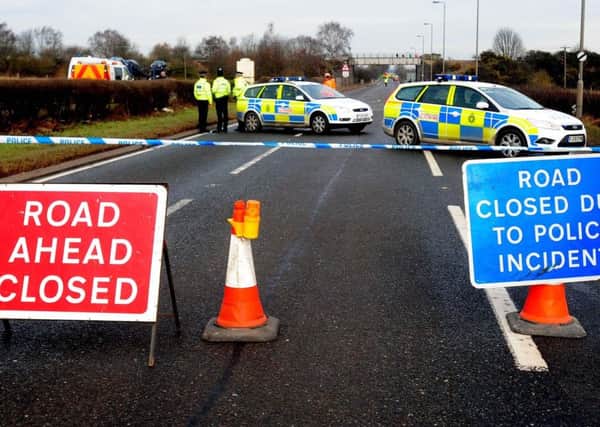 Police on the A614 in Nottinghamshire where six people were killed in a two-car crash.