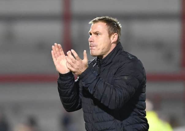 Mansfield Town manager David Flitcroft salutes the crowd after his sides 1-0 win at Morecambe: Picture by Steve Flynn/AHPIX.com, Football: Skybet League 2  match Morecambe -V- Mansfield Town at Globe Arena, Morecambe, Lancashire, England on copyright picture Howard Roe 07973 739229