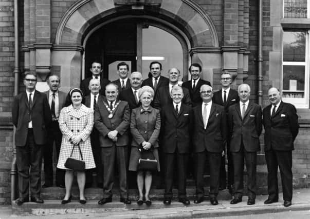 1970: This fabulous nostalgic shot features Hucknall urban district councillors and officials outside Hucknall Library, Market Place. Picture courtesy of Nottinghamshire Archives.