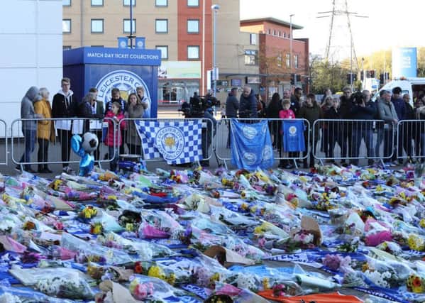 Flowers and tributes being left at the scene at the King Power Stadium in Leicester the morning after the helicopter crash.