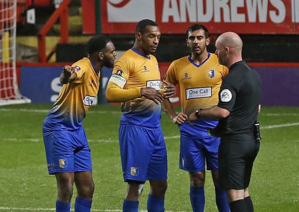 Picture by Gareth Williams/AHPIX.com; Football; Emirates FA Cup; Charlton Athletic v Mansfield Town; 20/11/18  KO 19:45; The Valley; copyright picture; Howard Roe/AHPIX.com; Mansfield skipper Krystian Pearce leads the inquest with referee Kevin Johnson after Charlton's controversial third goal