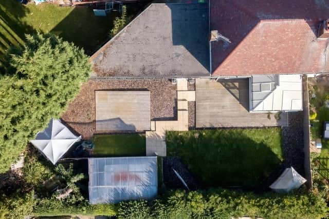 The home of Demi Harris and Christopher Pearson, with a covered hot tub in the garden.