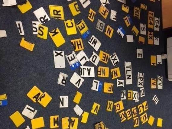 The cut up number plates.
