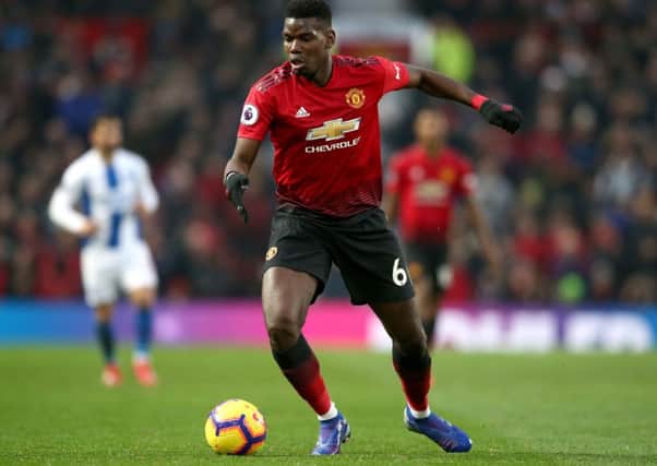 MANCHESTER, ENGLAND - JANUARY 19:  Paul Pogba of Manchester United runs with the ball during the Premier League match between Manchester United and Brighton & Hove Albion at Old Trafford on January 19, 2019 in Manchester, United Kingdom.  (Photo by Jan Kruger/Getty Images)