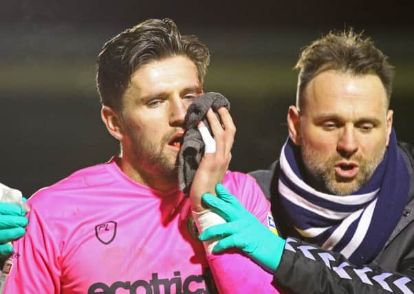 Picture by Gareth Williams/AHPIX.com; Football; Sky Bet League Two; Forest Green Rovers v Mansfield Town; 29/01/2019  KO 19:45; The New Lawn; copyright picture; Howard Roe/AHPIX.com; Forest Green Rovers keeper James Montgomery leaves the field with a bloody face after a collision with Gethin Jones