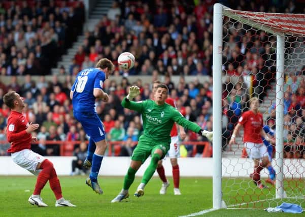 NOTTINGHAM, ENGLAND - MAY 04:  Andy King of Leicester City scores his sides second goal during the npower Championship match between Nottingham Forest and Leicester City at City Ground on May 4, 2013 in Nottingham, England.  (Photo by Laurence Griffiths/Getty Images)