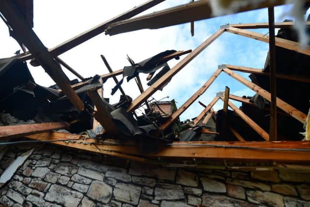 The tree crashed into the house on Saturday morning