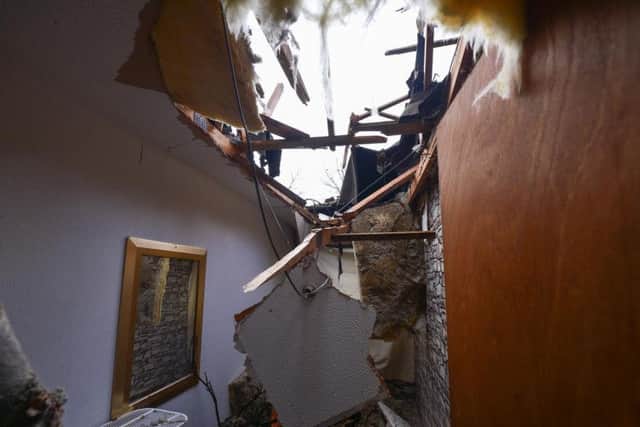 The 40ft tree damaged the roof, loft and the middle room at the back of the house.