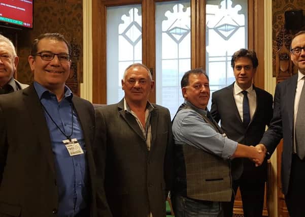 Minworkrs pension campaigners, from left: Barry Cox from Kent, Mick Newton of Mansfield, Norman Moore of Doncaster. Campaign organiser Les Moore shakes hands with Under-Secretary of State for Industry & Energy Richard Harrington, with Doncaster MP Ed Milliband.