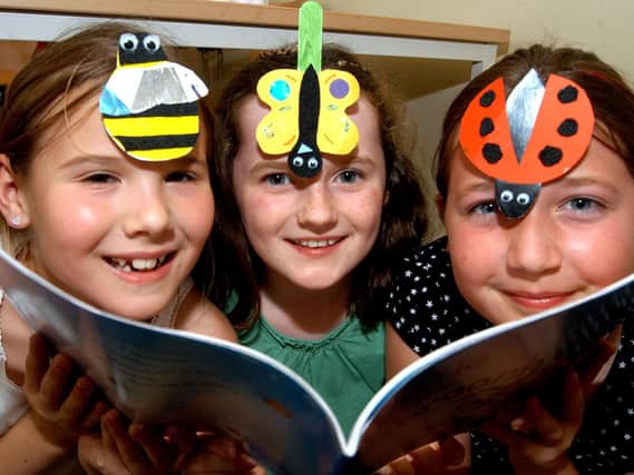 2007: This smiley trio are having fun making bugs and creepy crawlies at the Big Wild Read at Hucknall Library. From the left are: Abbie Wells, Sophie Neal and Abbie Plaskitt.